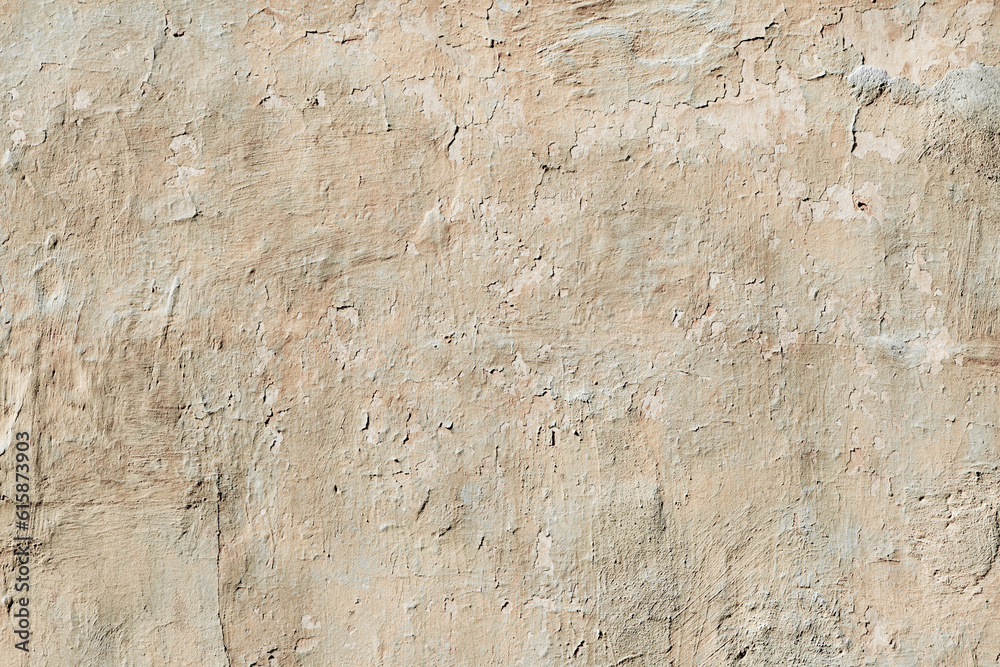 old wall covered with abstract cracked plaster