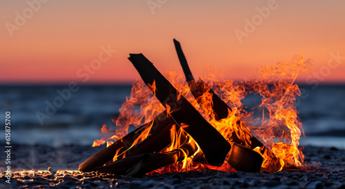 beautiful campfire in the middle of a beautiful beach in summer with a sunset in the background