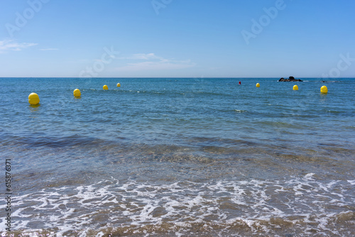 beach sea buoys and sky