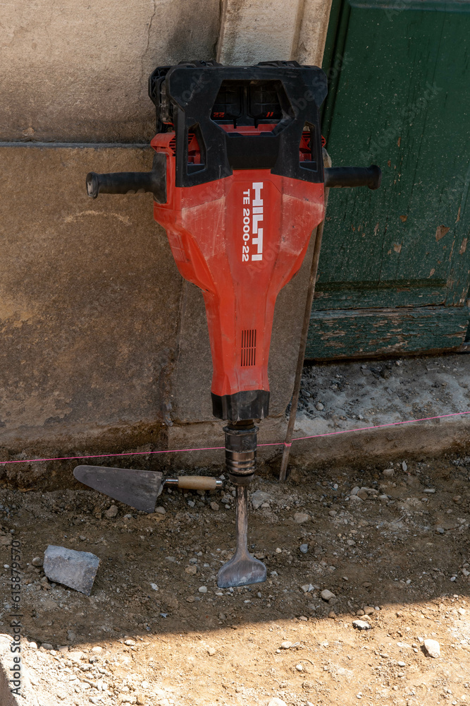 Hilti jackhammer at a construction site dirty and used in work Stock Photo Adobe Stock