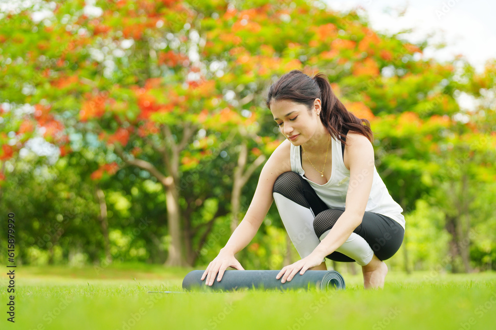 Pleasant millennial woman practice yoga outdoor in the morning during wellness retreat.