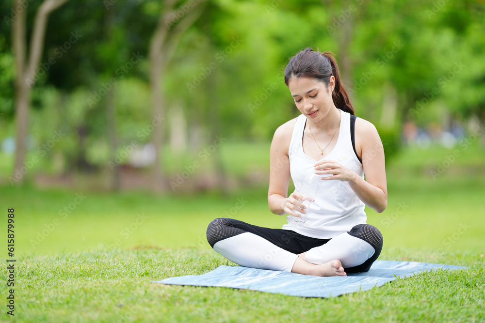 Pleasant millennial woman practice yoga outdoor in the morning during wellness retreat. Pleasant millennial woman practice yoga outdoor in the morning during wellness retreat.