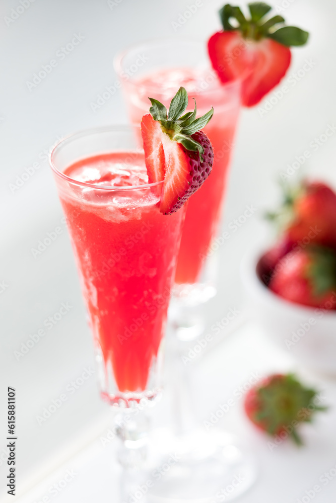 Refreshing strawberry Mimosas garnished with fresh cut strawberries. Refreshing strawberry Mimosas garnished with fresh cut strawberries.
