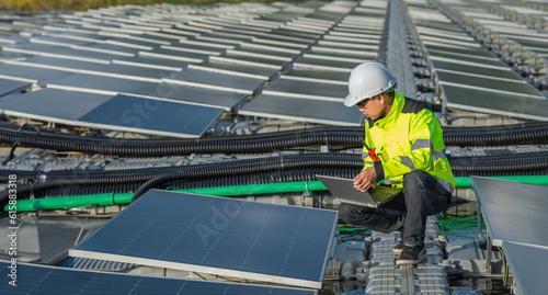 Asian engineer working at Floating solar power plant,Renewable energy,Technician and investor solar panels checking the panels at solar energy installation