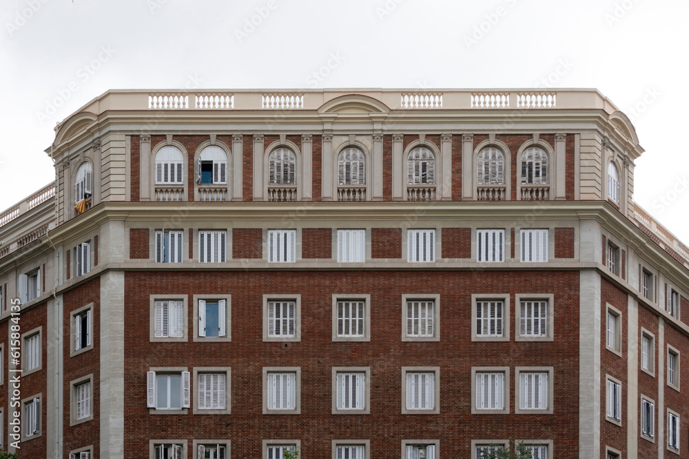 Facade of a building with windows and balconies