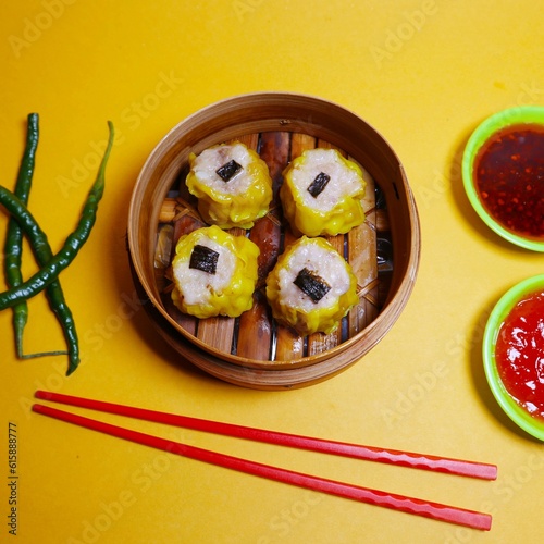 hot and delicious dimsum photo with a sweet and sour tomato sauce, a perfect blend to accompany your day

