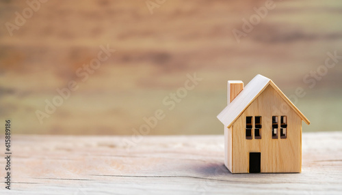 wood house model for real estate property buy sale concept loan