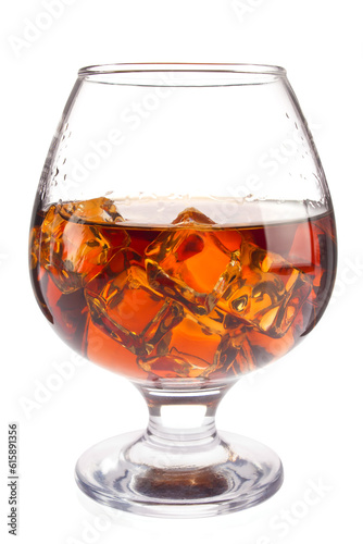 Brandy with ice in goblet, isolated on white background.