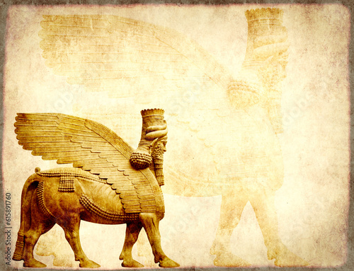 Grunge background with paper texture and lamassu - human-headed winged bull statue, Assyrian protective deity photo