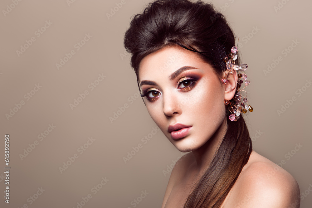Beautiful woman with professional make up and hairstyle