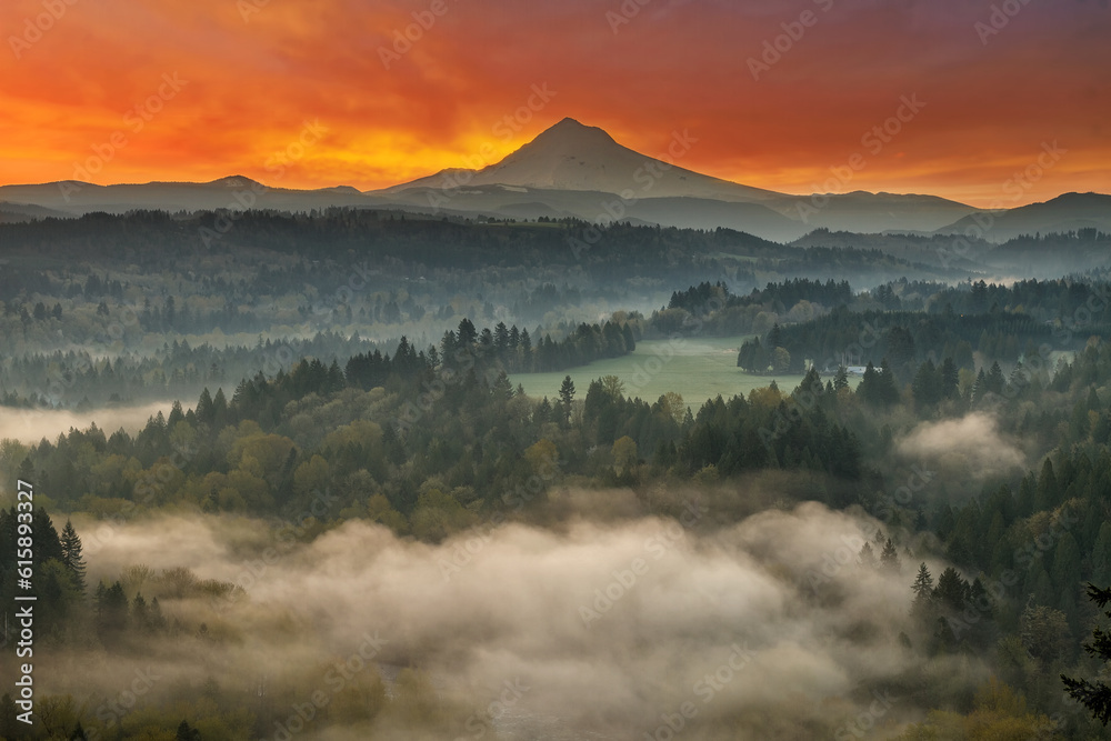 Mount Hood over foggy Sandy River Valley at Jonsrud Viewpoint during sunrise