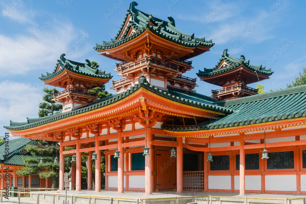 Detail of abstract Shinto temple roof featuring traditional green and orange ornament in park in Kyoto, Japan Detail of abstract Shinto temple roof featuring traditional green and orange ornament in park in Kyoto, Japan