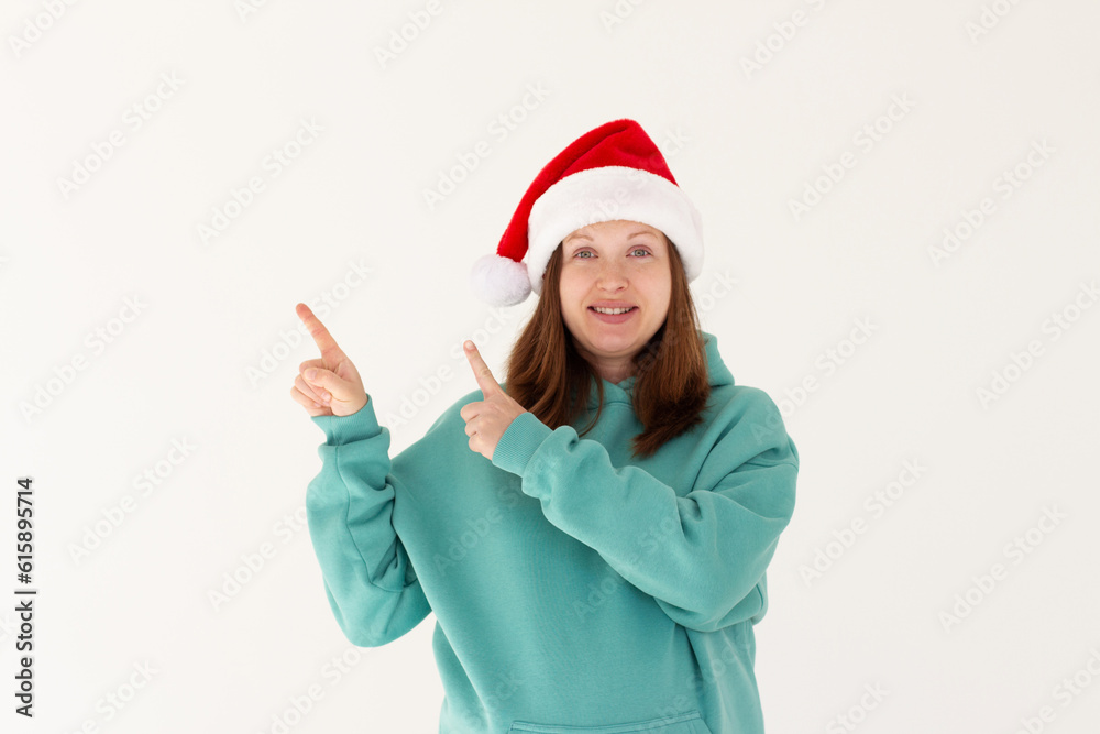 Photo of charming pregnant lovely pretty nice girl in santa claus headwear point index finger copyspace, indicate x-mas jolly holly advertisement isolated over white color background Photo of charming pregnant lovely pretty nice girl in santa claus headwear point index finger copyspace, indicate x-mas jolly holly advertisement isolated over white color background