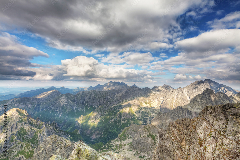 View on high Tatra Mountains from Rysy mountain with dramatic cloudy sky View on high Tatra Mountains from Rysy mountain with dramatic cloudy sky