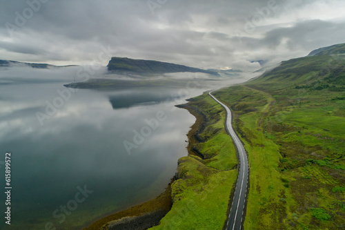Desolate curving road leading into an icelandic fjord