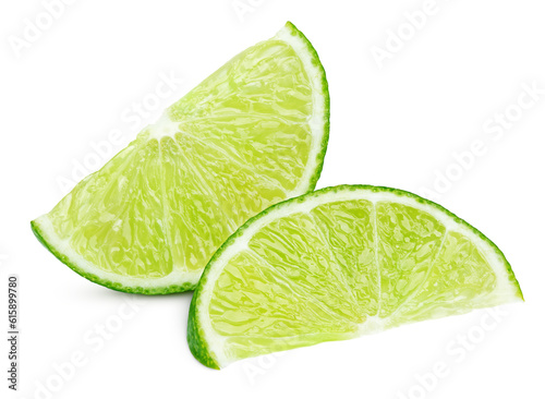 Two ripe slices of green lime citrus fruit isolated on white background with clipping path