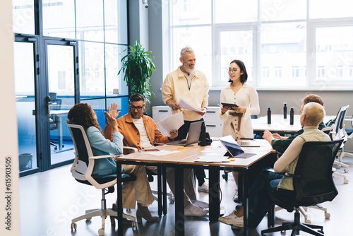 Multiethnic colleagues discussing business strategy in office