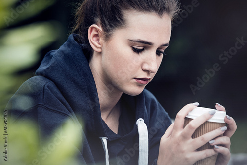 Slika na platnu Beautiful sad depressed girl teenager female young woman drinking takeaway coffe
