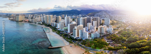 Sunrise panoramic view of the densest parts of Honolulu at Waikiki and its beach and hotels photo