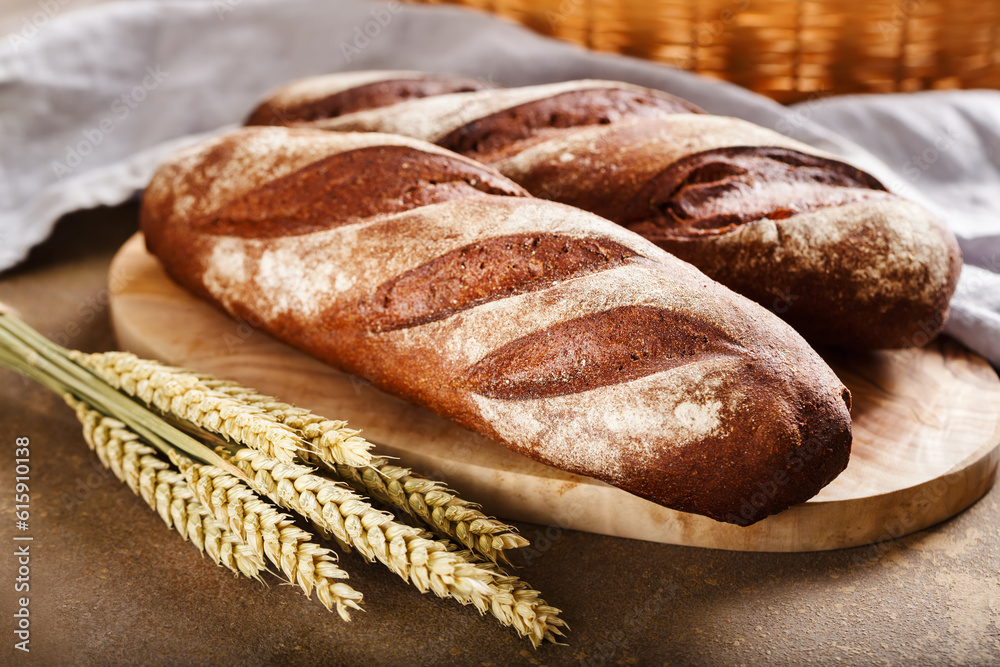 Freshly baked baguette close up. Food background.