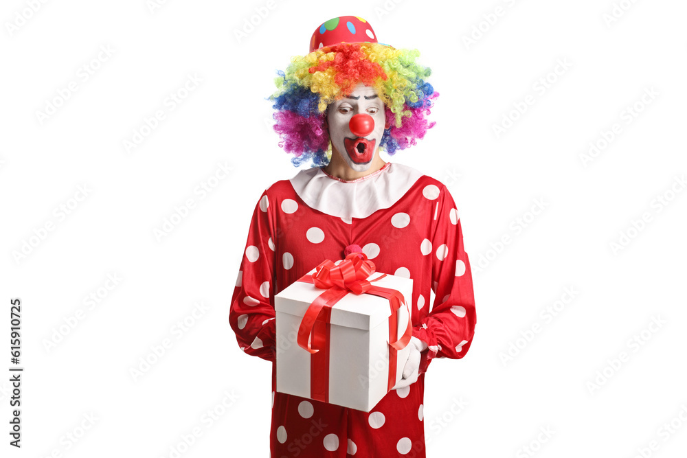 Clown in a red costume holding a present box Clown in a red costume holding a present box