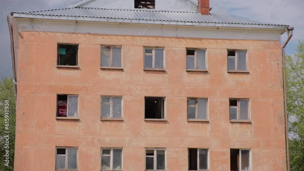 Old abandoned house with collapsed walls. Clip. Abandoned residential building with no windows. Ruins of old residential building with bricks