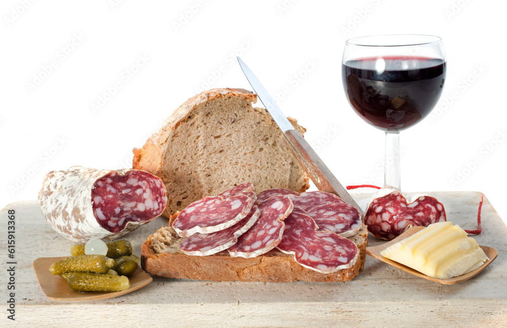 saucisson, bread and butter in front of white background saucisson, bread and butter in front of white background