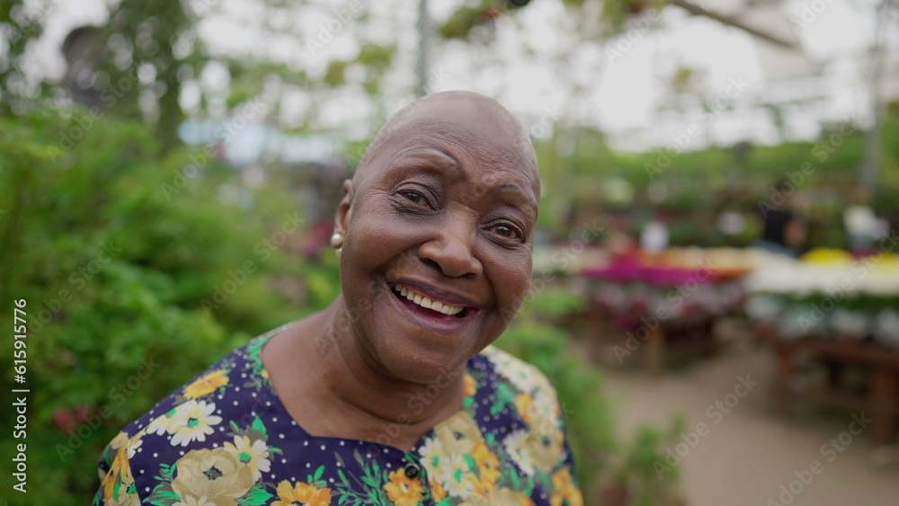 Portrait of a Brazilian older woman close-up face looking at camera standing inside a Green Environment Portrait of a Brazilian older woman close-up face looking at camera standing inside a Green Environment