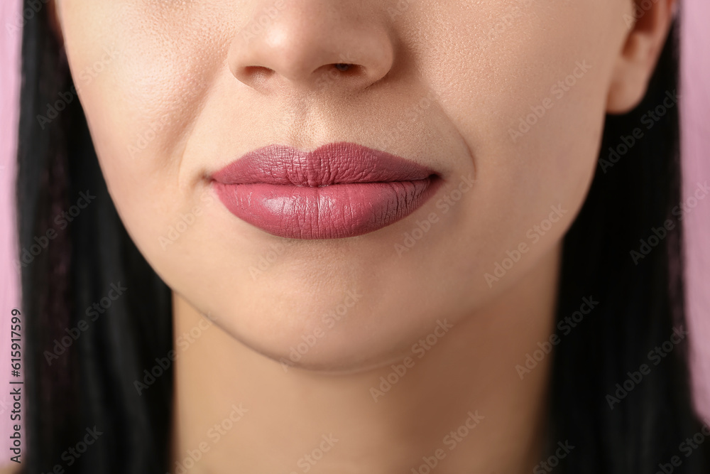 Fototapeta premium Woman with applied lipstick on pink background, closeup