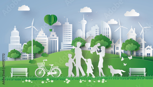 Concept of Eco with happy family walking on the field .Paper art style.