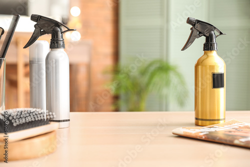 Bottles of spray on table i...