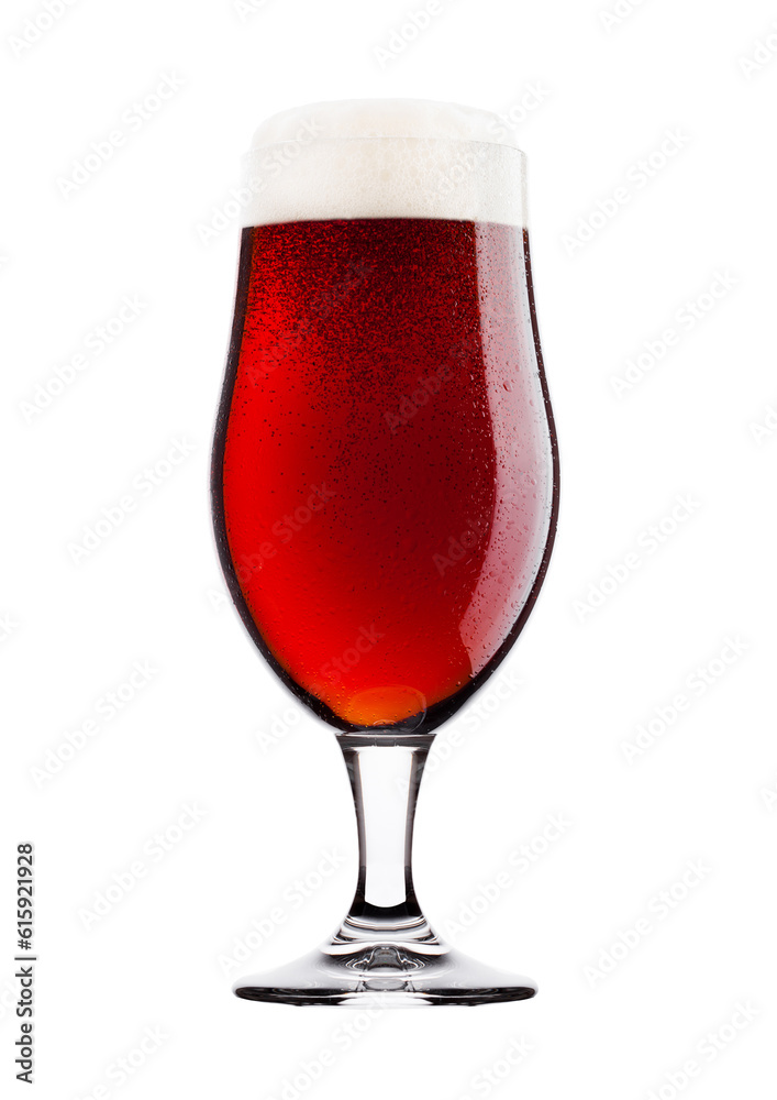 Cold glass of red bitter beer with foam and dew isolated on white background Cold glass of red bitter beer with foam and dew isolated on white background