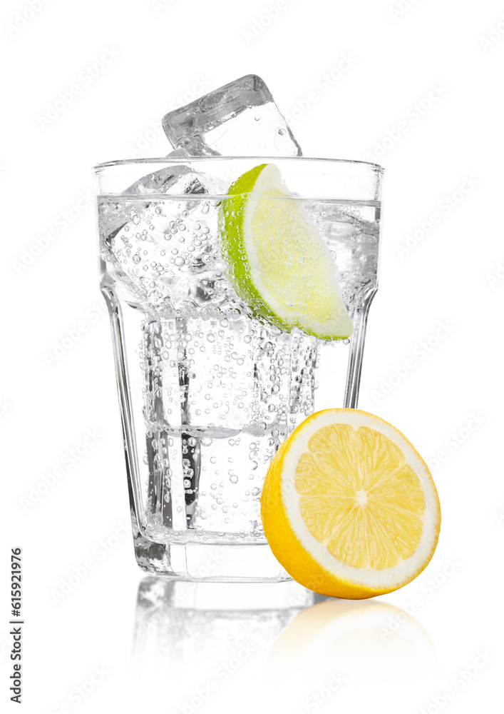 Glass of sparkling water soda drink lemonade with ice and lime lemon slice on white background Glass of sparkling water soda drink lemonade with ice and lime lemon slice on white background