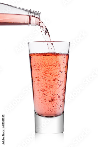 Wallpaper Mural Pouring pink soda lemonade from bottle to glass on white background Torontodigital.ca