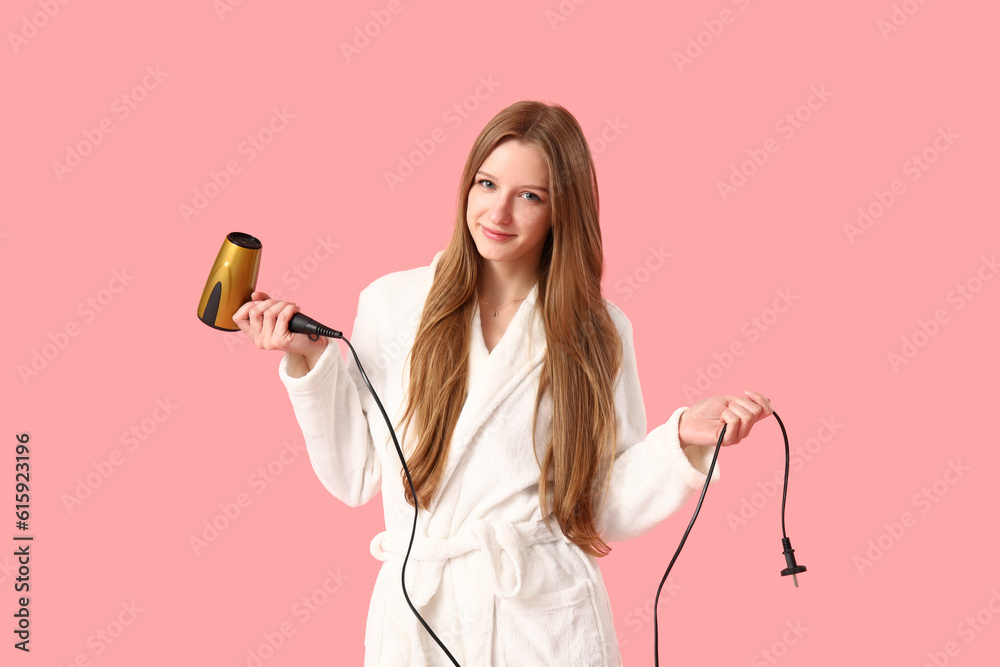 Beautiful young woman with hair dryer on pink background Beautiful young woman with hair dryer on pink background