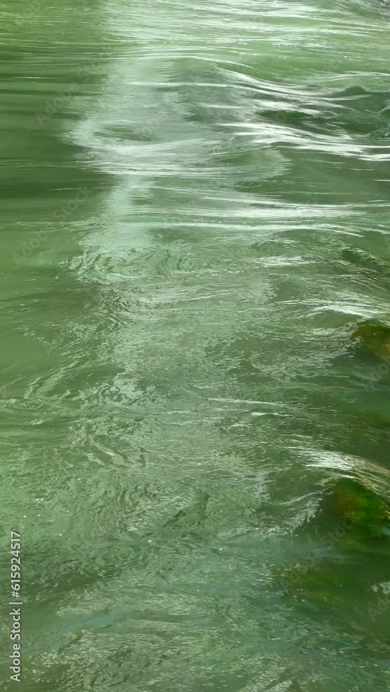 a flowing river surface a flowing river surface