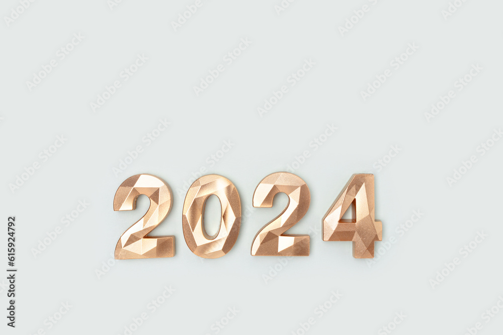 2024 golden numbers on a blue background. New Year minimal concept with copy space. 2024 golden numbers on a blue background. New Year minimal concept with copy space.