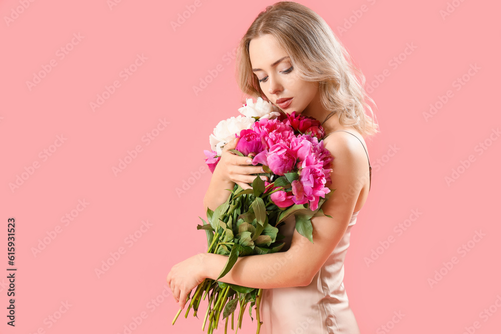 Young woman with beautiful peony flowers on pink background Young woman with beautiful peony flowers on pink background