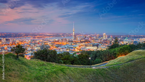 Cityscape image of Auckland skyline, New Zealand taken from Mt. Eden at sunset.
