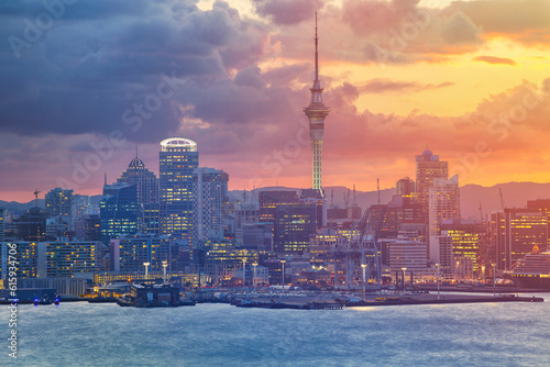 Cityscape image of Auckland skyline, New Zealand during sunset.