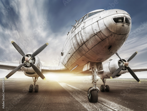 historical aircraft on a runway is waiting for take off
