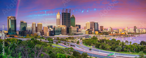 Panoramic cityscape image of Perth skyline, Australia during dramatic sunset.