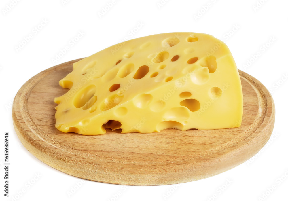 a piece of cheese with large holes lies on a white board