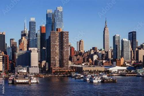 Photo of midtown Manhattan cityscape in New York city  taken from a ferry on the Hudson.