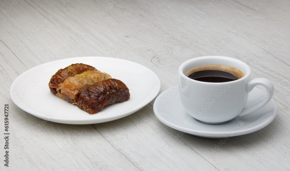 sweet oriental baklava and a mug of strong fragrant coffee. selective focus sweet oriental baklava and a mug of strong fragrant coffee. selective focus