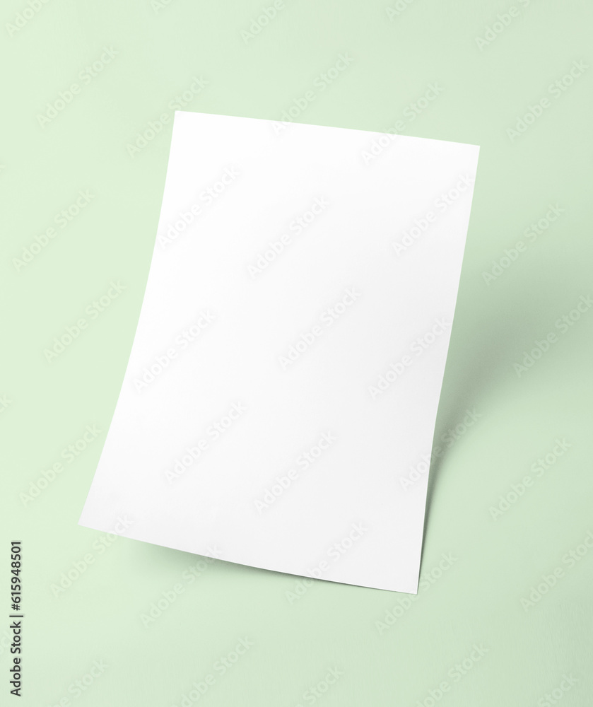 The white blank document paper template with green background The white blank document paper template with green background