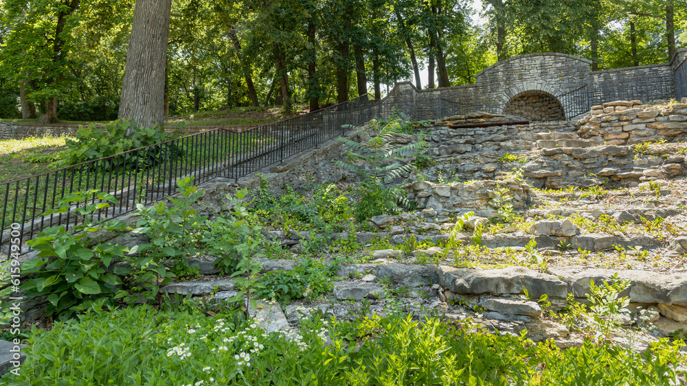 abandoned water feature from the 1920's with stairs and a forest in the background abandoned water feature from the 1920's with stairs and a forest in the background