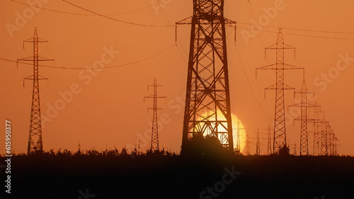High voltage power lines at sunset
