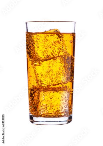 Glass of orange energy carbonated soda drink with ice on white background