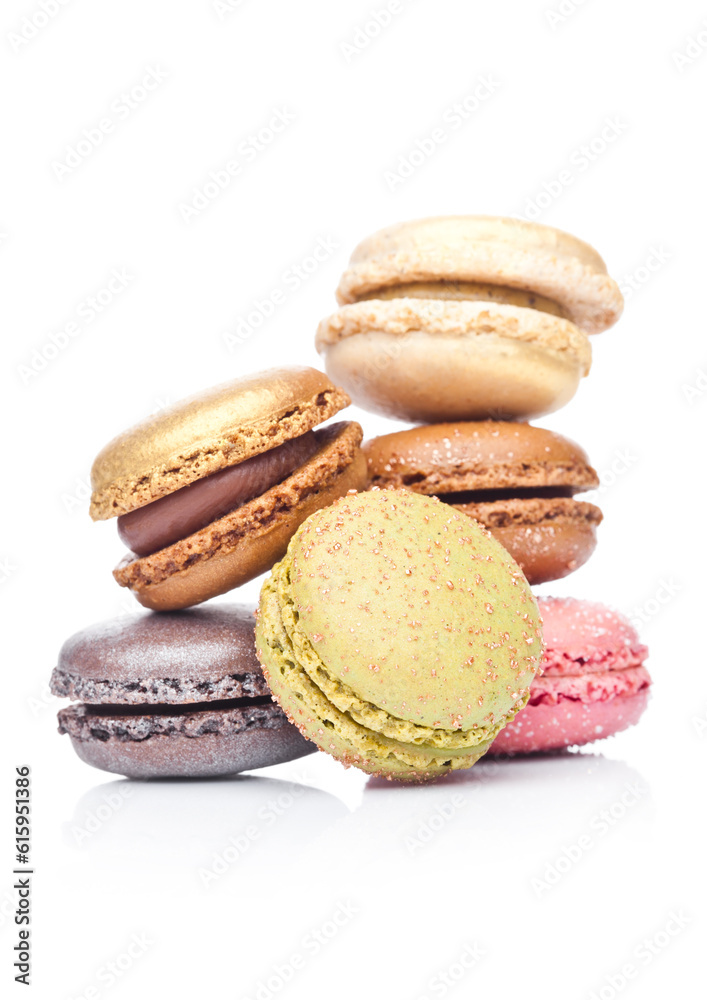 French luxury colorful macarons dessert cakes on white background with sugar on top French luxury colorful macarons dessert cakes on white background with sugar on top